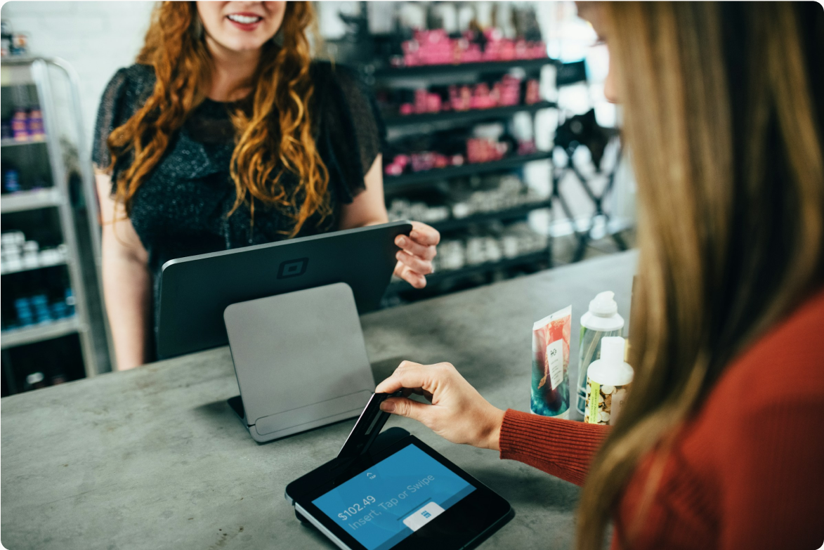 Woman paying with store card photo